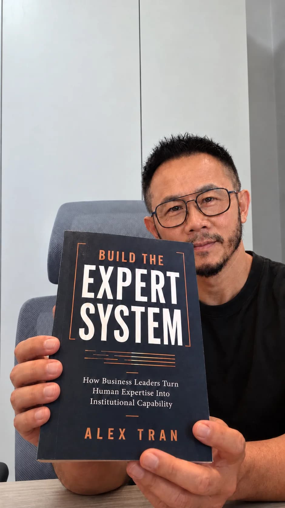 Alex Tran holding Build the Expert System